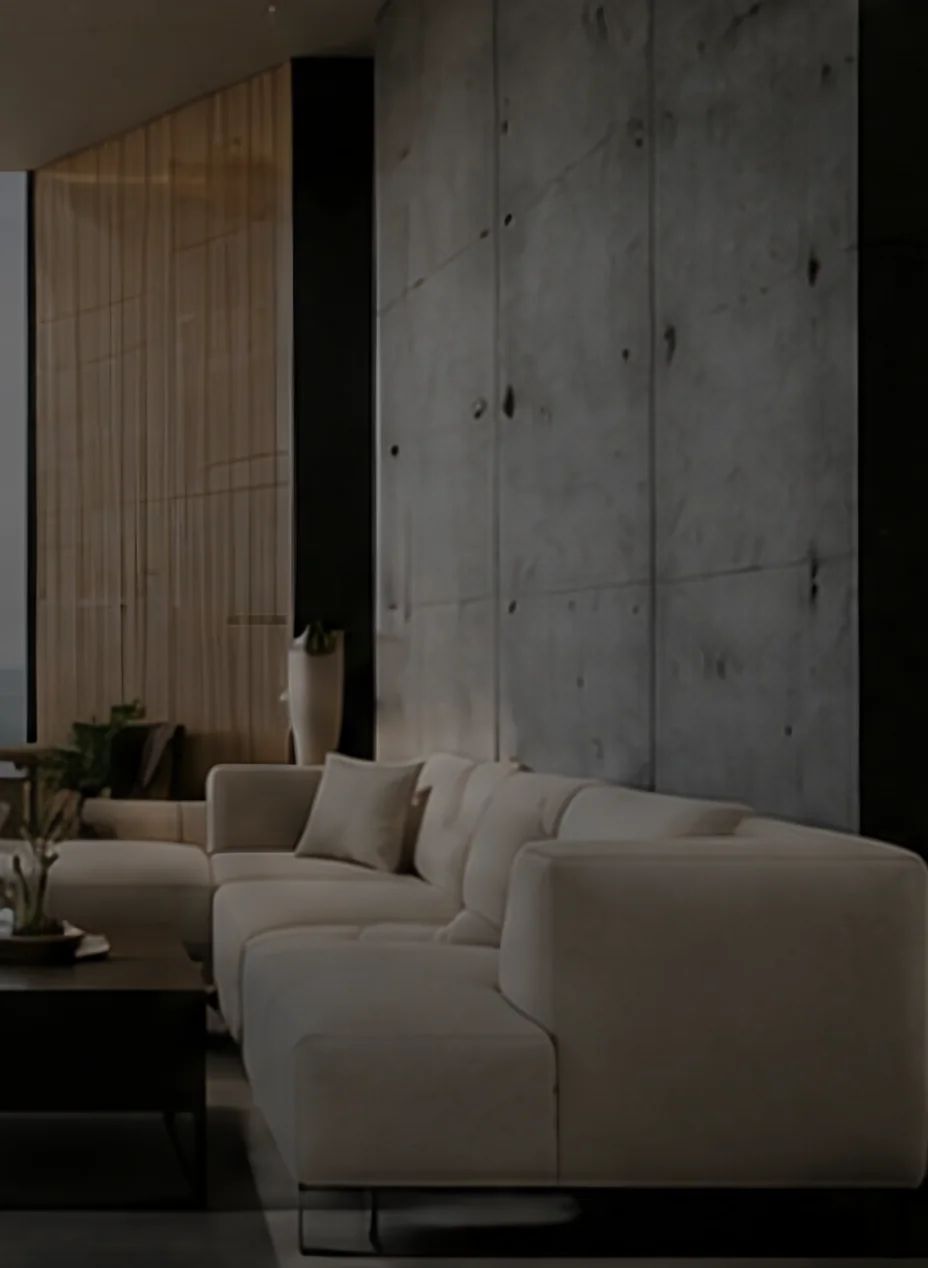 Living room with a board-formed concrete wall, timber slat panel and a deep linen sofa