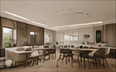 Open dining and work area with a long table, pendant lights and timber ceiling details